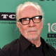 John Carpenter attends an event, maybe wishes he was at home watching basketball instead.